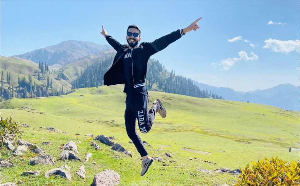 Couple enjoying sunset view in Hunza Valley during a romantic tour.